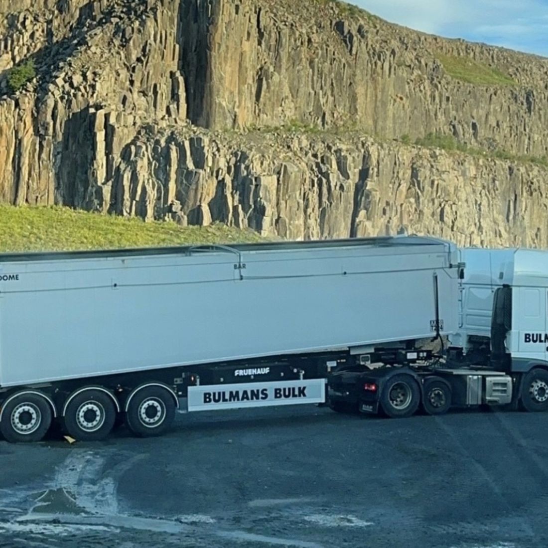 A Bulmans Bulk Haulage truck in a quarry setting.